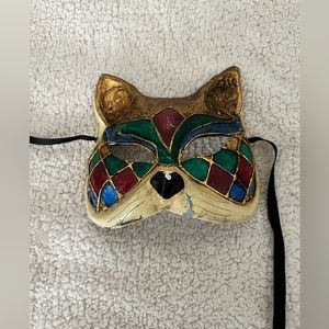 Harlequin Venetian cat mask ribbons. Halloween masquerade costume eyes wide shut
